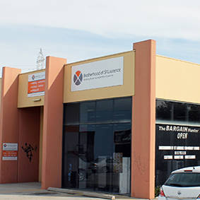 Image of the side of the Deer Park store from the car park with orange pillars and Brotherhood signage visible
